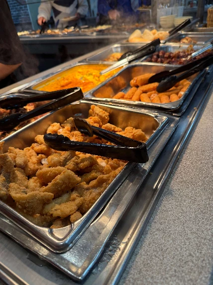 Buffet trays filled with assorted food